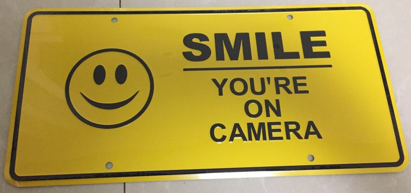 SMILE YOU'RE ON CAMERA ALUMINUM EMBOSSED LICENSE PLATE