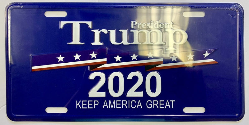 Assorted President Trump license plates and USA Collectors Set Auto Tags